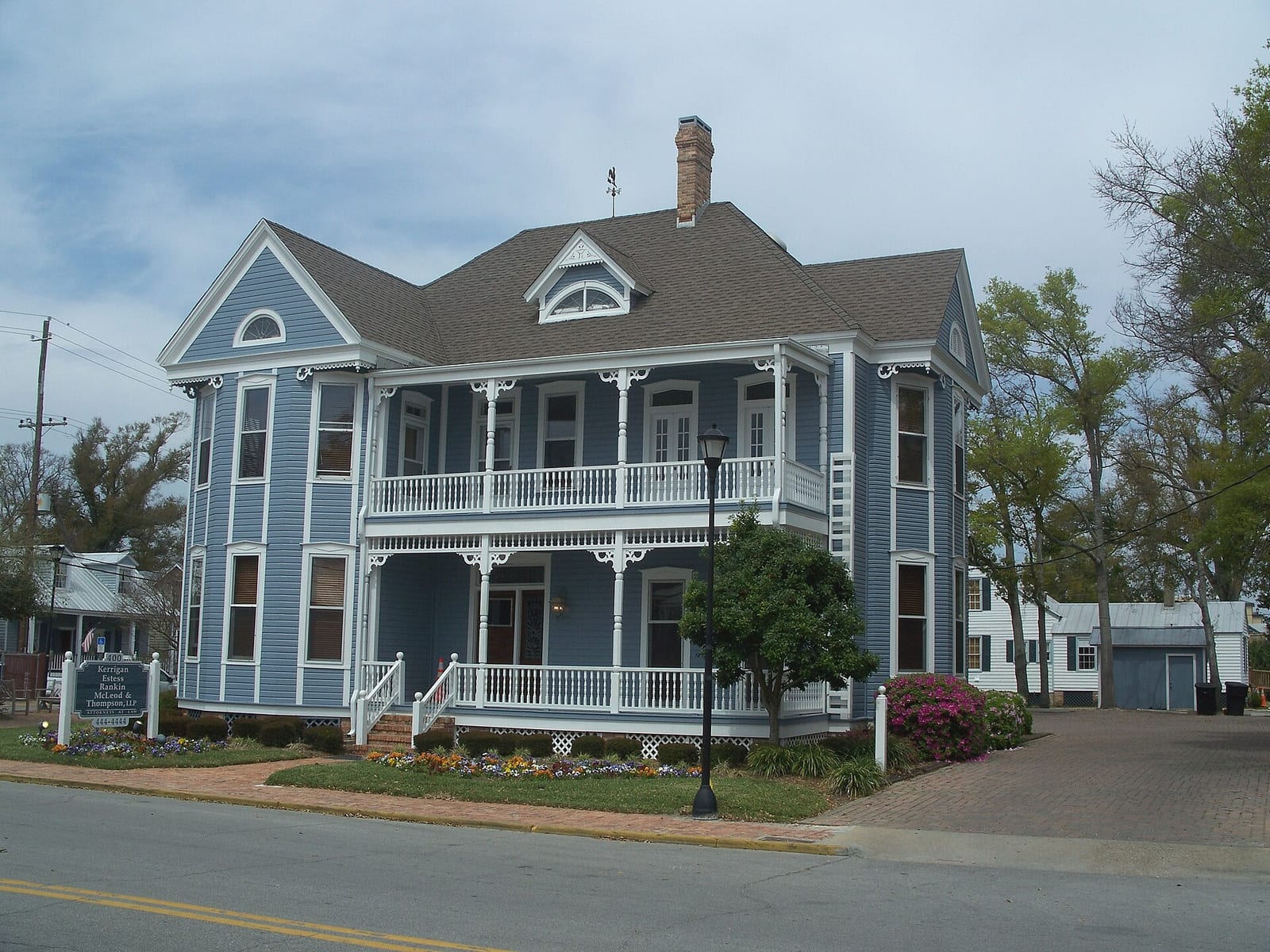 Blue historic Pensacola house with a shaded front porch